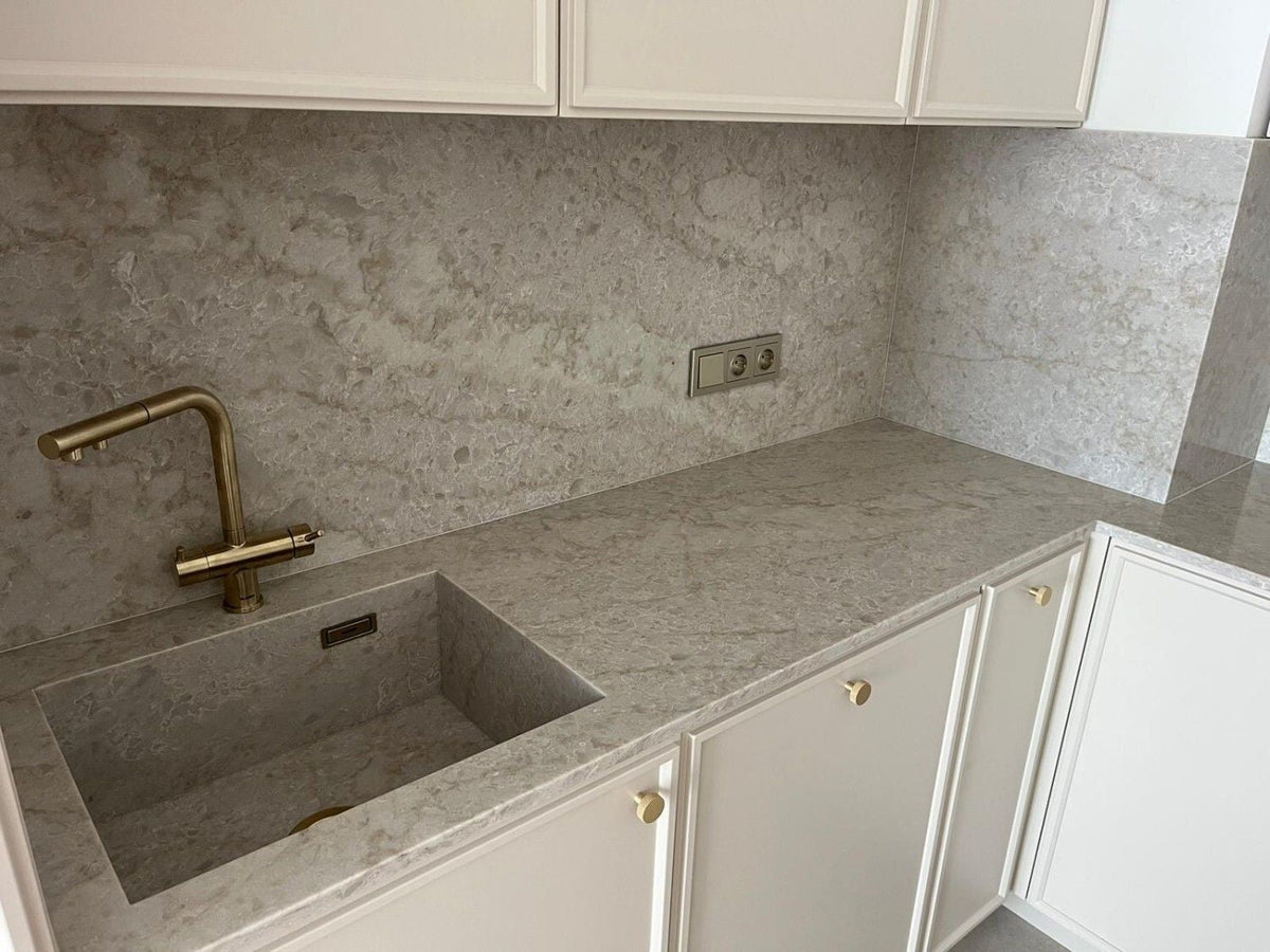 Grey quartz countertop with an undermount sink and brass tap, fabricated by Videa Stone