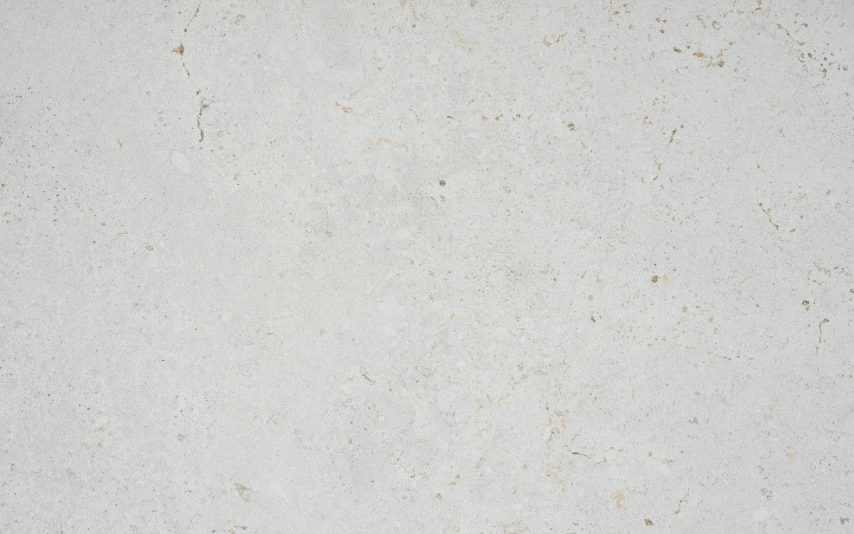 Polar ceramic countertop - beige limestone-look Dekton surface with fossil detail