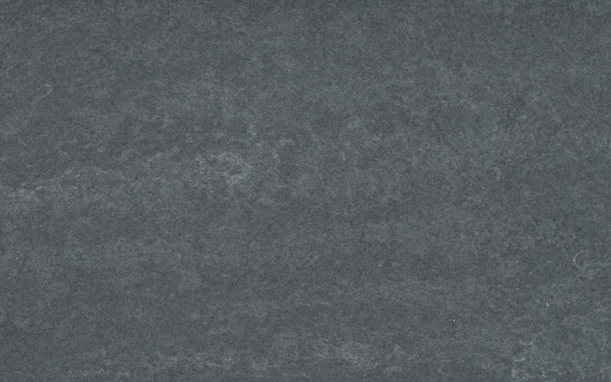 Raw G quartz countertop - concrete grey with copper touches Silestone surface